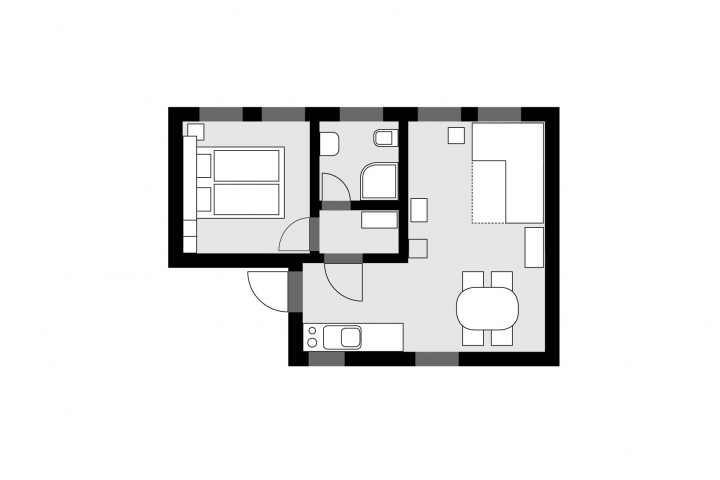 mittelgroße Wohnung (D), Grundriss
v.l.n.r.: Schlafzimmer, Bad, Garderobe, Wohnzimmer mit Kaminofen, Schlafsofa, Küchenzeile und Essplatz