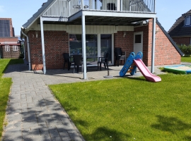 Ferienhaus Krabbe Friedrichskoog Rasen vorn