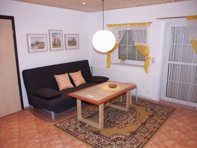 Wohnzimmer, Sitzecke - mit Doppelbettcouch