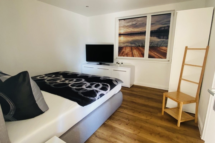 Schlafzimmer mit verdunkelnden Fotorollo